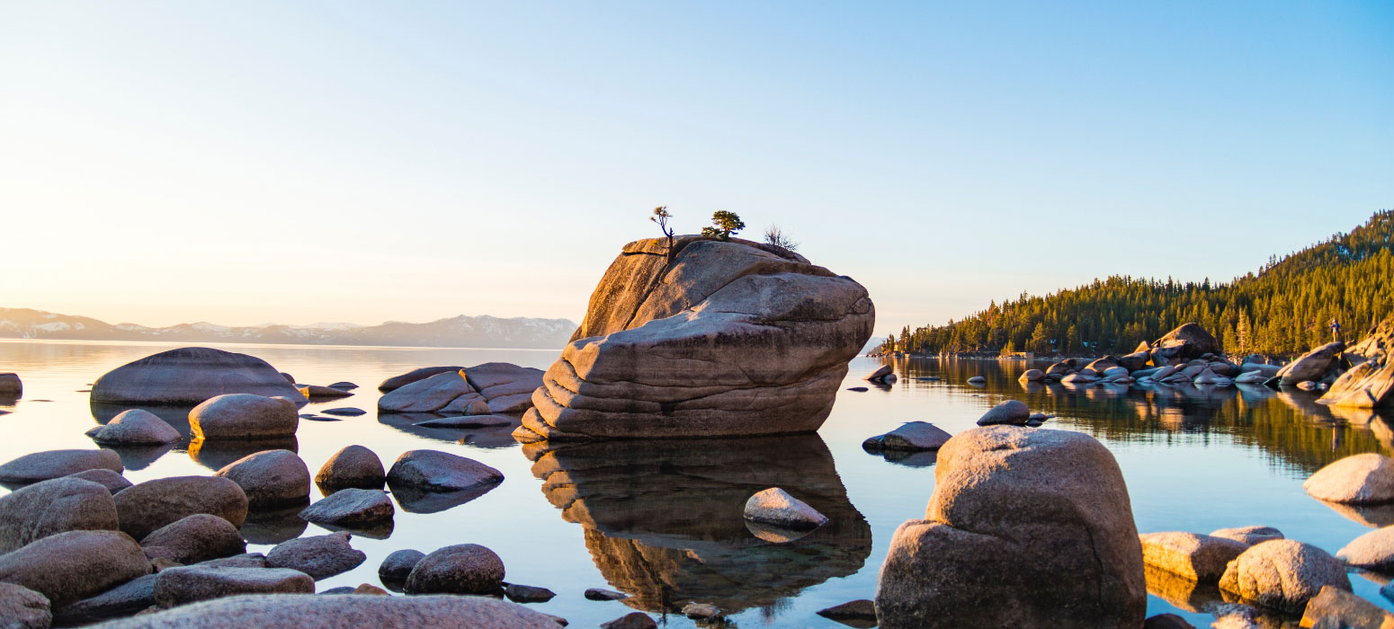 Rock standing alone in large lake